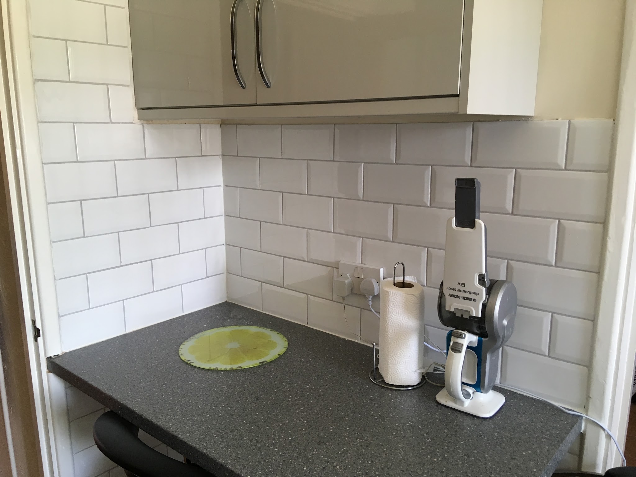 Kitchen worktop corner with white metro tiles